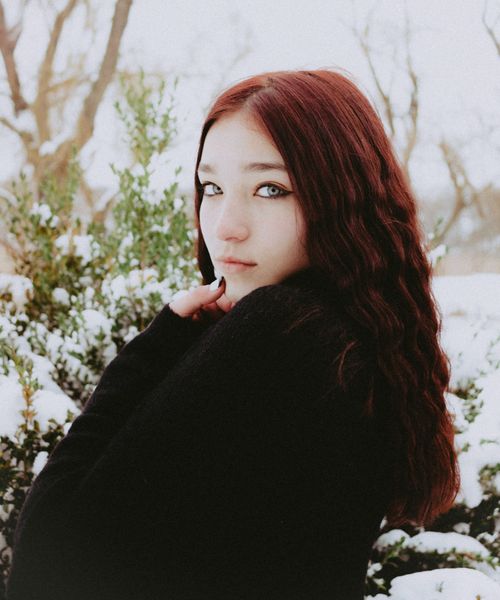 Free Red-haired woman in a snowy landscape, showcasing winter fashion and natural beauty. Stock Photo