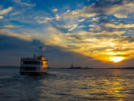 Ferryboat on Sea Under Blue Sky During Sunset
