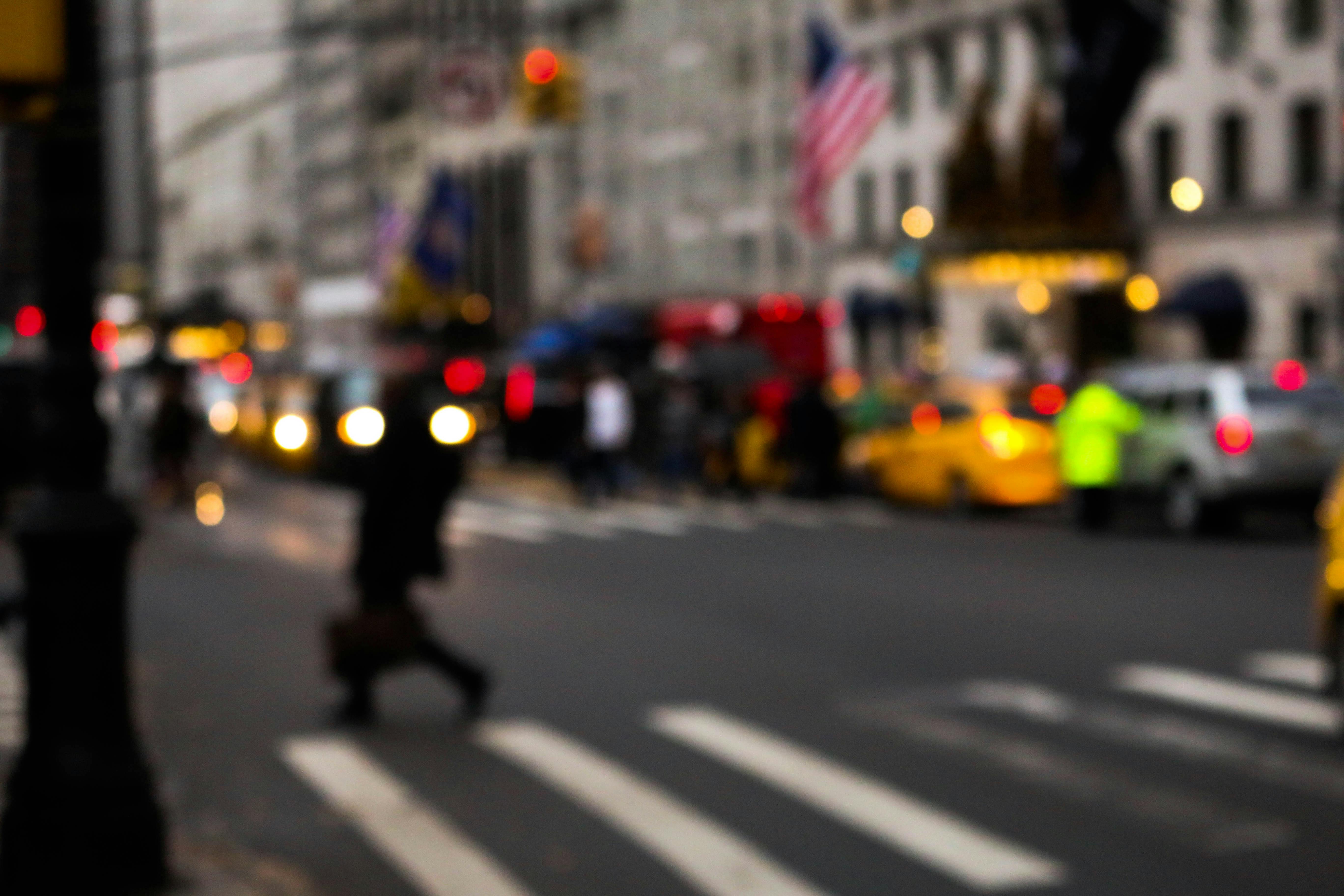 Diverse group of people watching an event on a large screen, representing a global streaming audience.