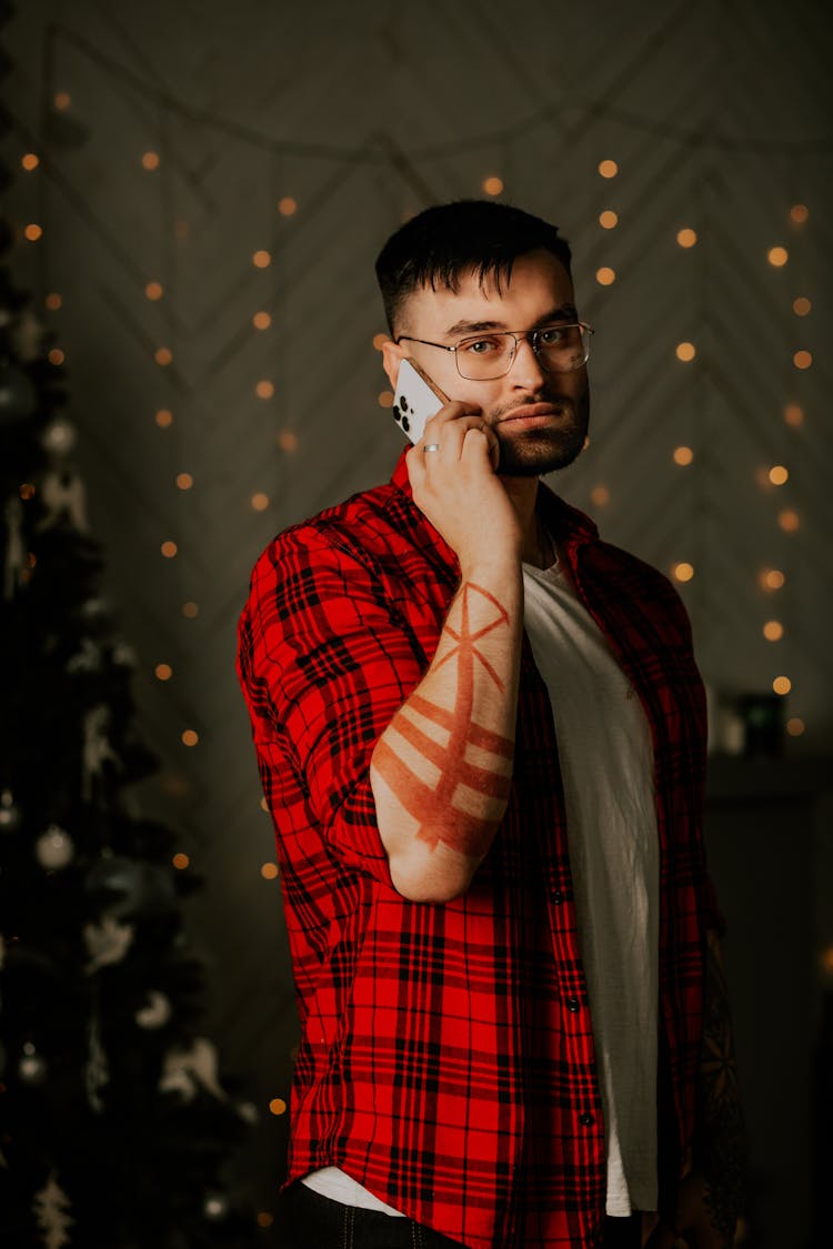 Man In Red Plaid Shirt Talking On Phone