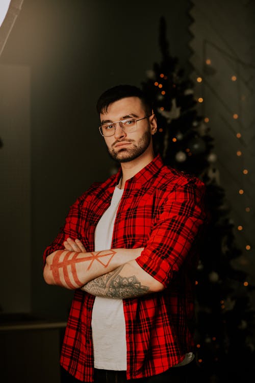 Free Photo of a Man in a Red Plaid Shirt Posing with His Arms Crossed Stock Photo