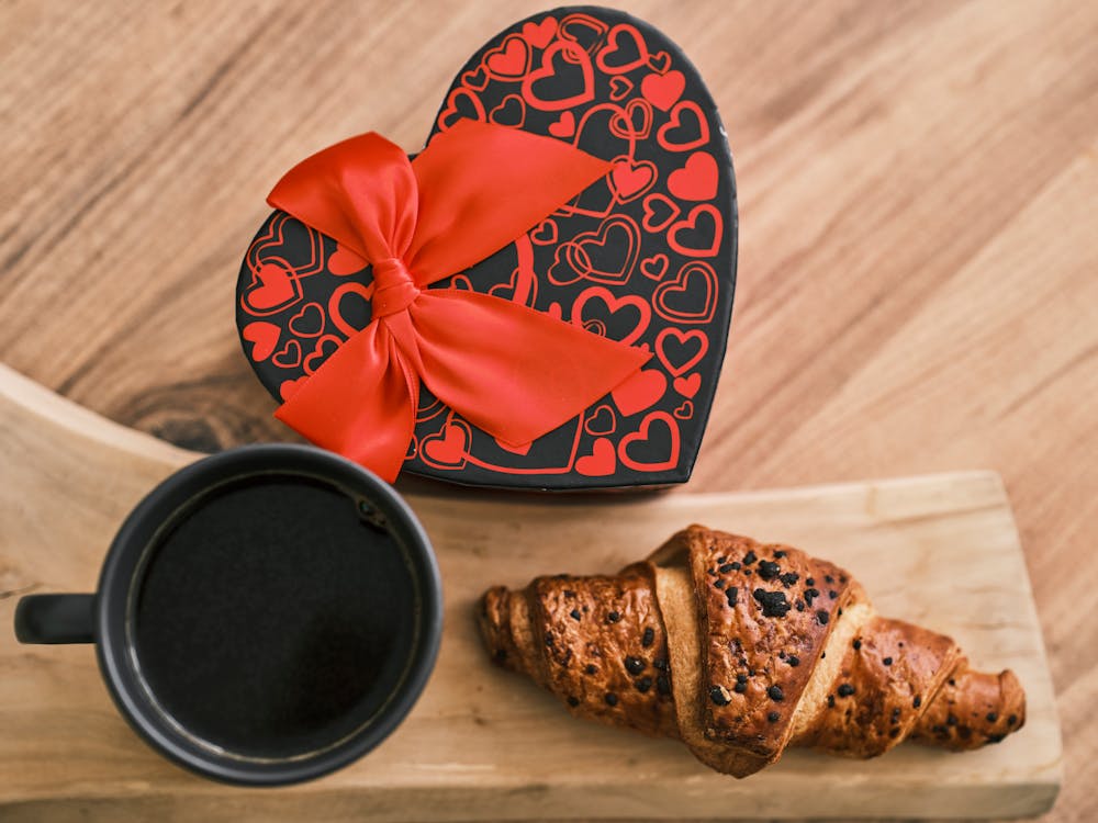 Free Croissant Beside a Cup of Coffee Stock Photo