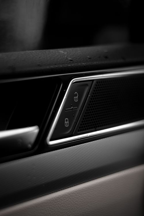 Free Detailed close-up image of car door lock buttons in a modern vehicle interior. Stock Photo