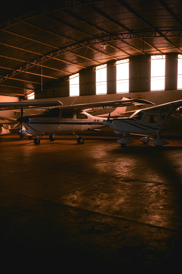 Airplanes In Hangar Building