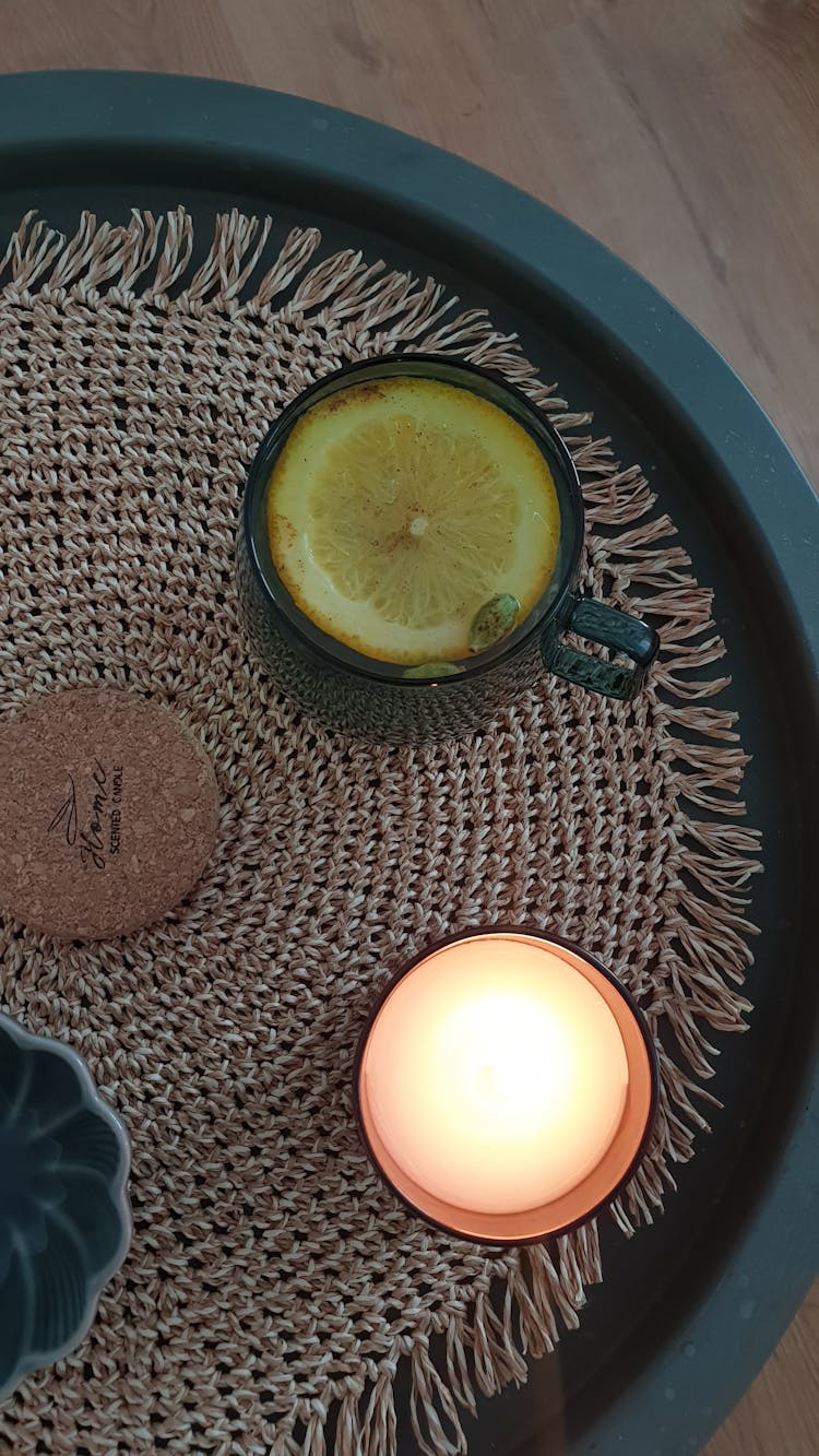 Overhead Shot Of A Drink Near A Lit Candle