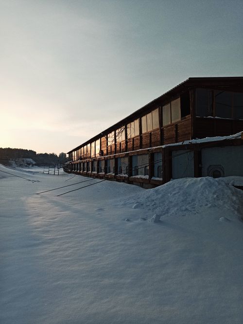 Free A serene winter scene featuring a building under a snowy sky in Berdsk, Russia. Stock Photo