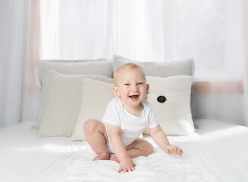 Free Laughing Baby Wearing White Shirt Stock Photo