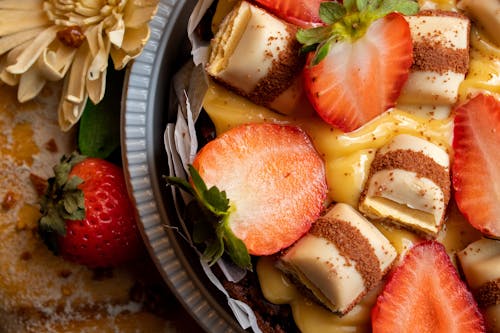 Close-Up Photograph of a Dessert with Sliced Strawberries