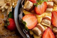 Close-Up Photograph of a Dessert with Sliced Strawberries