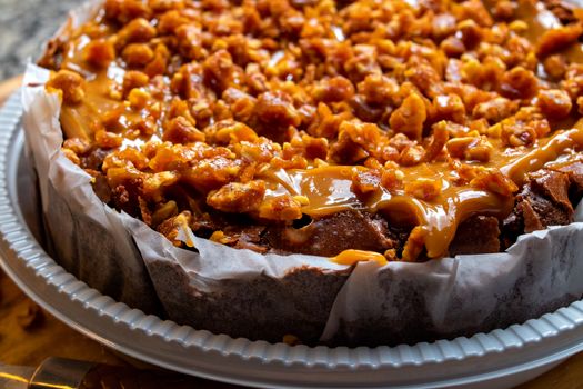 Mouth-watering caramel nut cake with a rich, delicious topping, perfect for dessert lovers.