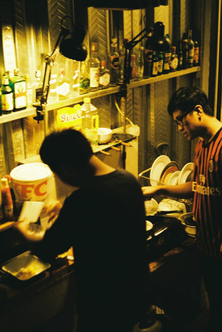 Men Busy Preparing Food In The Kitchen