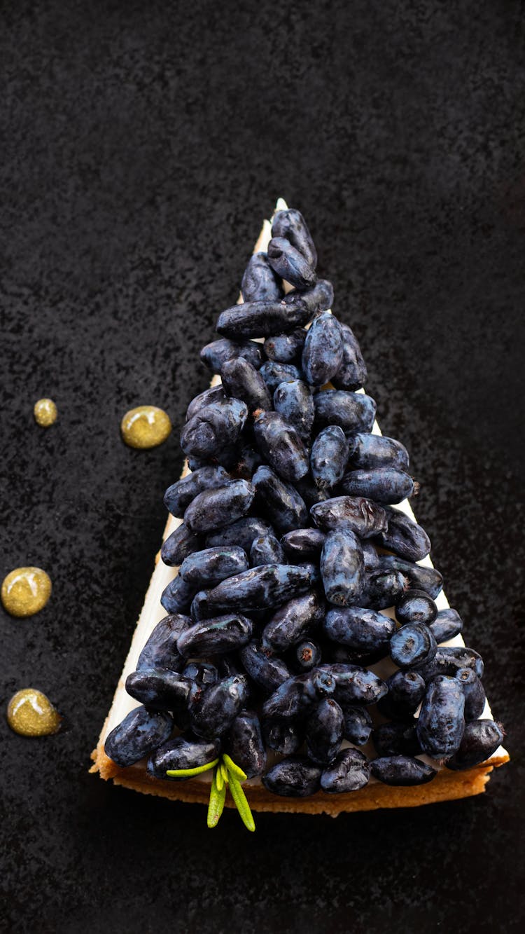 Slice Of Cake With Blueberries On Top