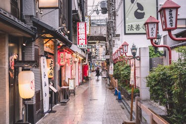 Person Walking on Street Near Buildings