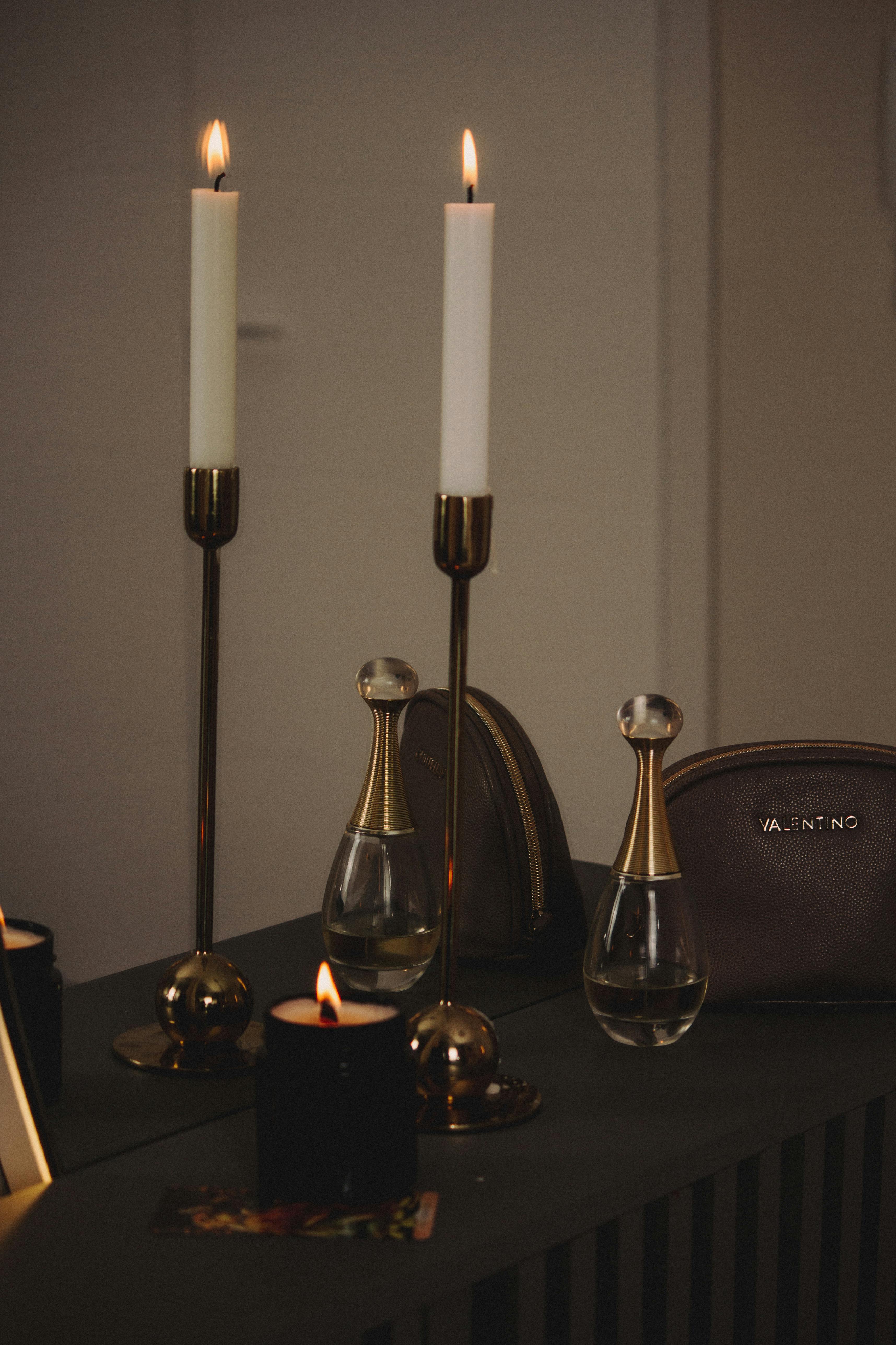 Free A refined still life featuring candelabras and designer elements, ideal for cozy interior design themes. Stock Photo