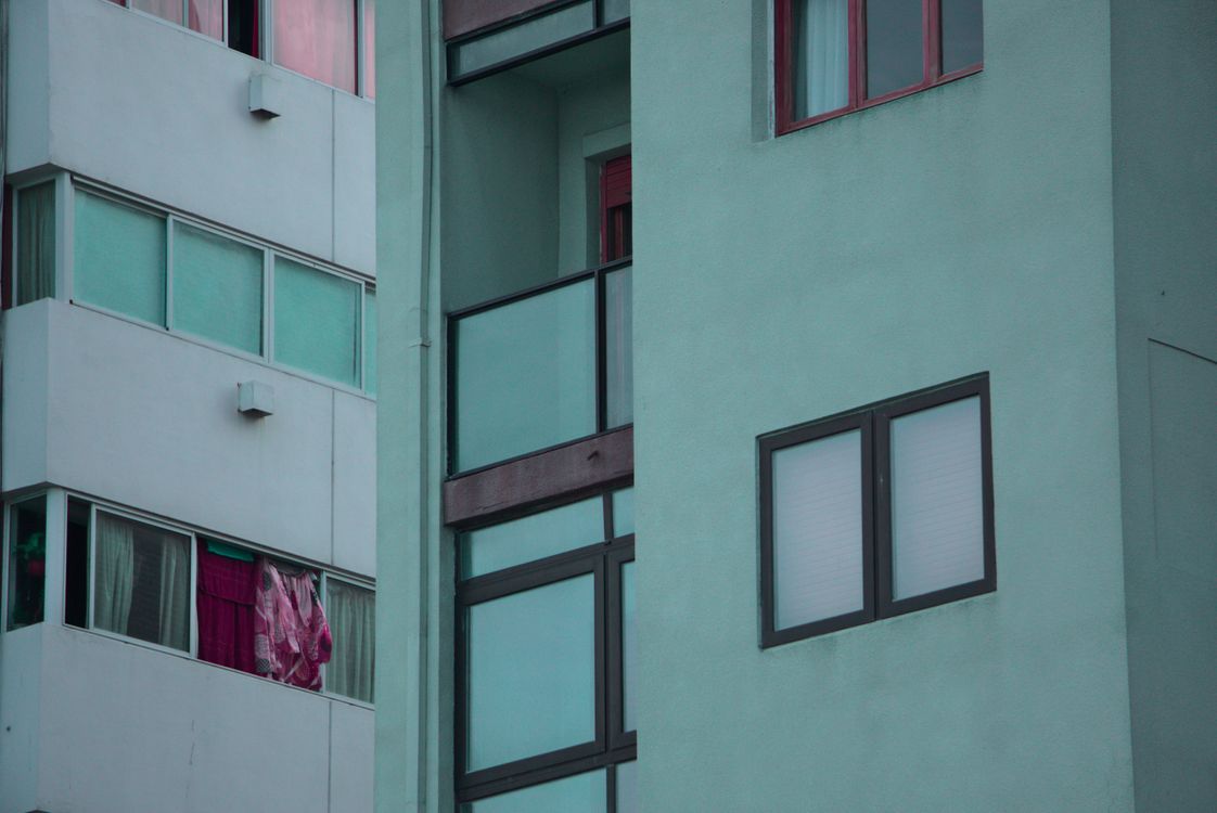 Mint Green Concrete Buildings with Glass Windows · Free Stock Photo