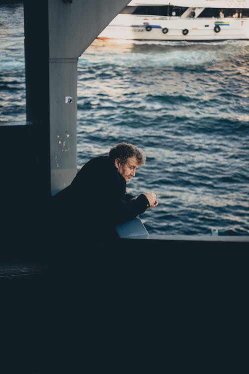 Man with Mask on Ship