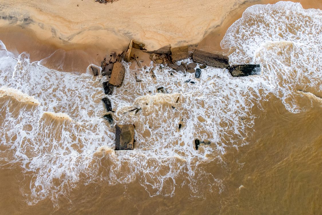 Shooting Rocks Beach Aerial Shot of Big Rocks on the Seashore · Free Stock Photo