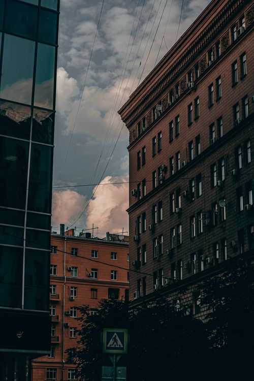 Free Urban scene in Moscow featuring classic and modern architecture under a cloudy sky. Stock Photo