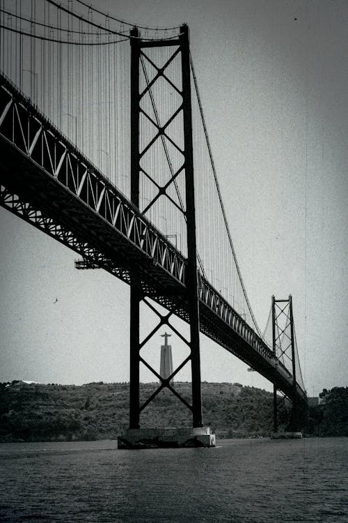 Black and White Shot of the 25 de Abril Bridge in Lisbon, Portugal