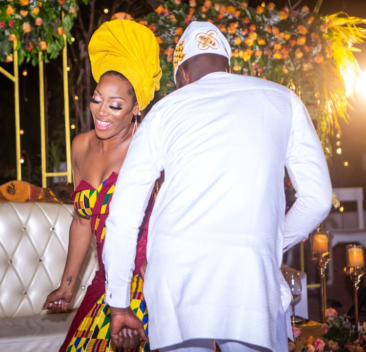 African Couple Dancing At Party