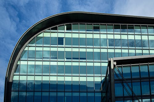 Modern Glass Building on Blue Sky