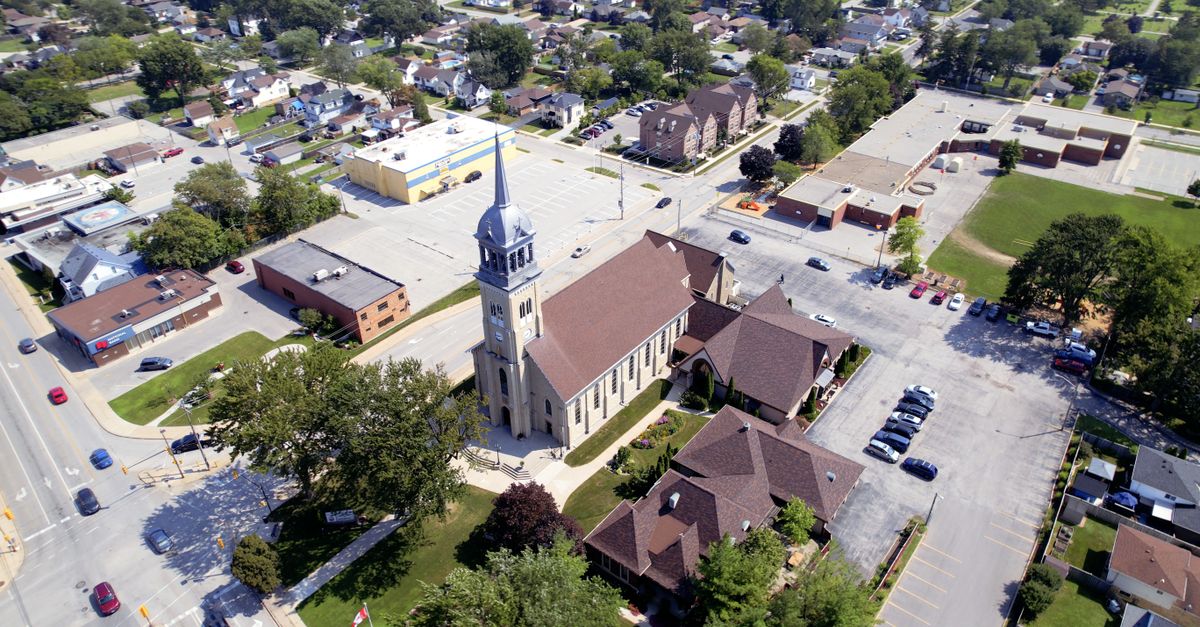 Aerial view of Ho, Ghana, with a focus on the Barracks Newtown neighborhood and a small church building