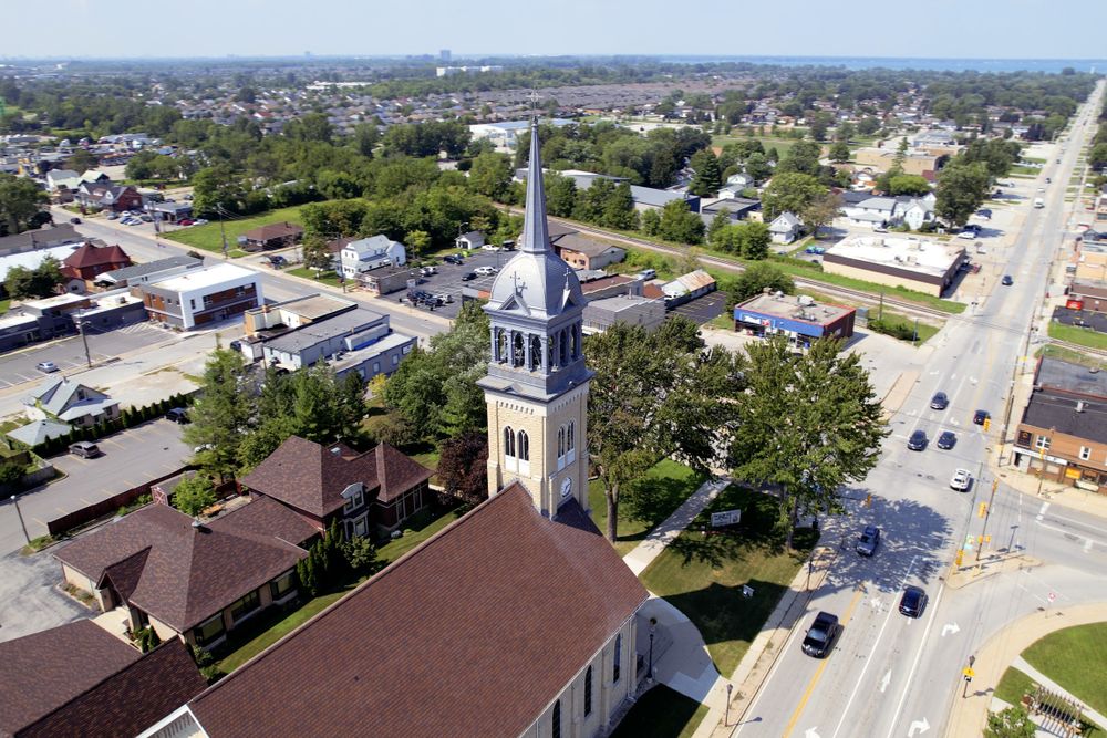 Elevated view of a historic church amidst urban landscape in Windsor, Ontario, Canada.