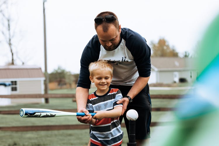 Dad Teaching Son To Play Baseball 