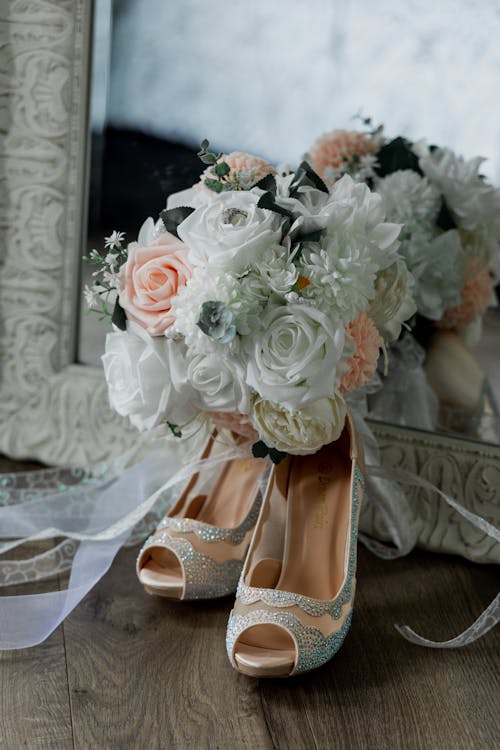 Free High Heels and a Bouquet of Flowers Stock Photo