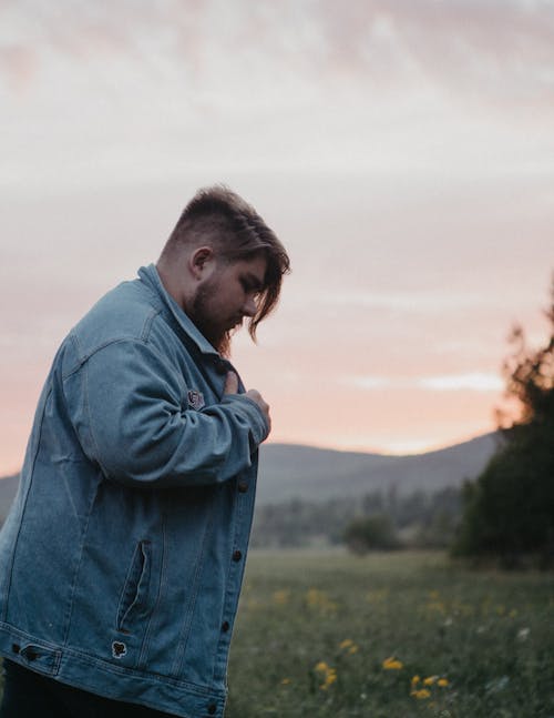 Photo of a Man in Denim Jacket