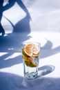 Glass of Beverage with Wedges of Citrus Fruits