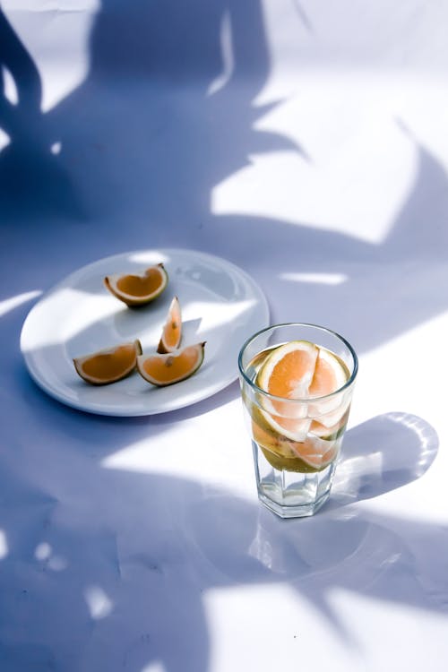 Citrus Wedges in Drink and on Plate