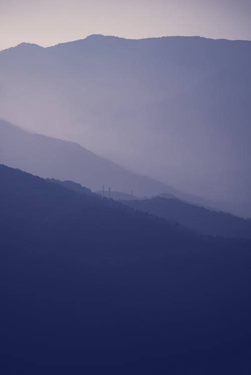 Silhouette of Foggy Mountains