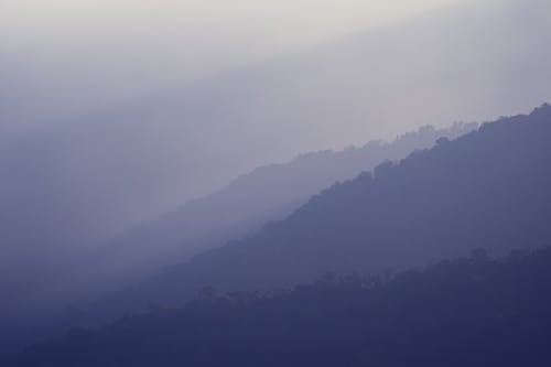 Silhouette of Foggy Mountains
