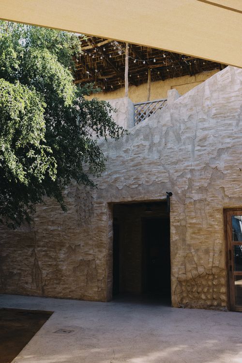 Free Explore a rustic courtyard showcasing traditional Arabic architectural style in Dubai. Stock Photo