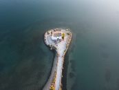 Discover the scenic beauty of the Ypapanti Church located on an islet in Corfu, Greece.