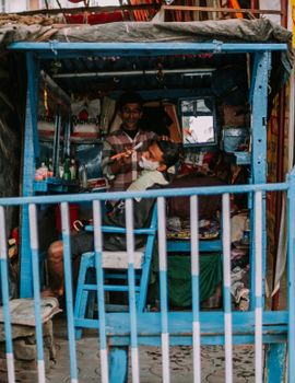 A traditional barbershop scene showcasing an intimate grooming session within a vibrant setting.