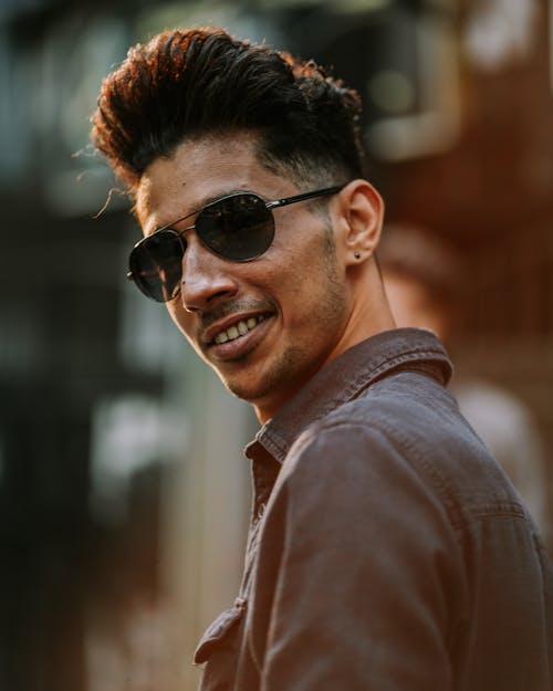 Man Wearing Sunglasses in Close Up Photography