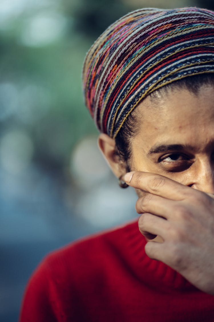 Man In Turban With Hand Over Mouth