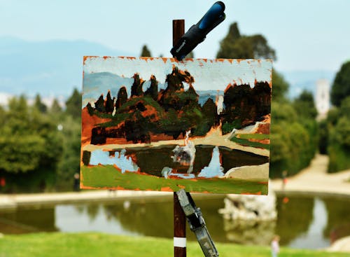 Painting of Body of Water on Front of the Model during Day