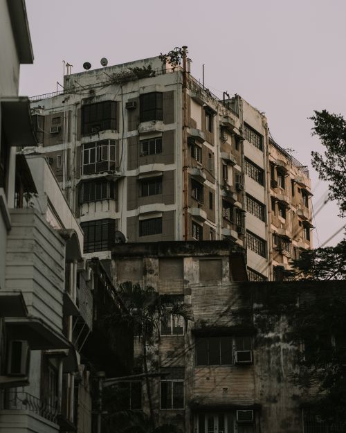 Free Aged and weathered apartment buildings showcasing urban decay and character. Stock Photo