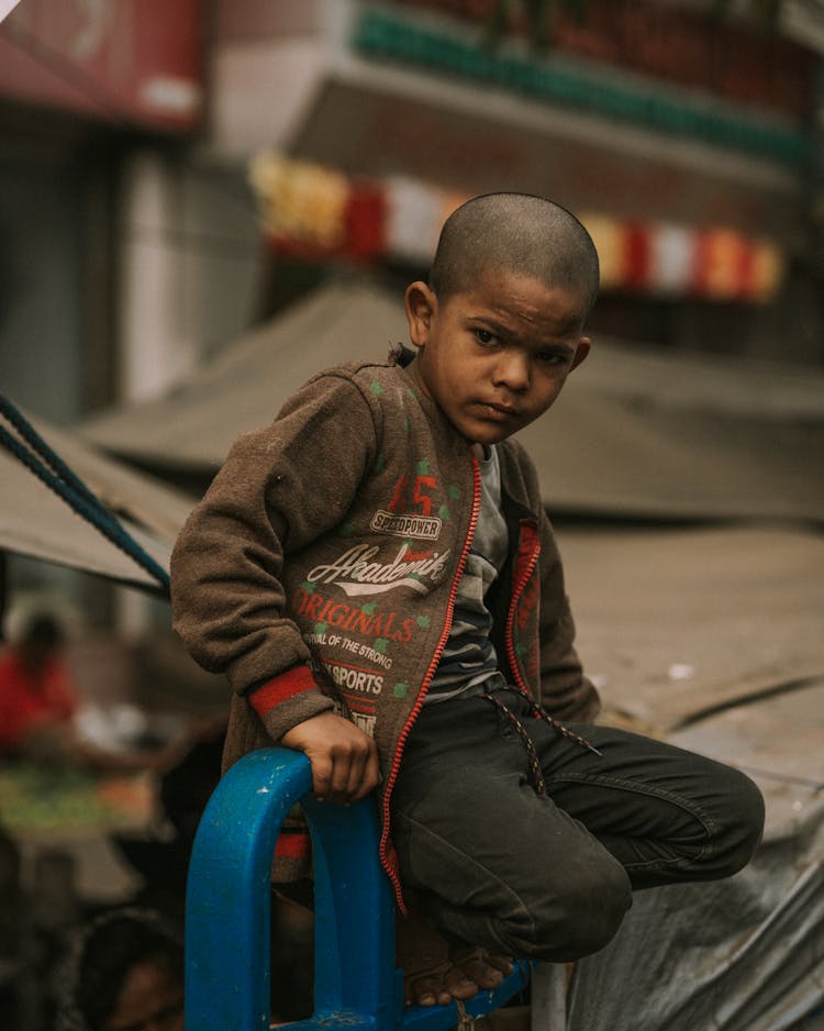 Boy With Short Hair Sitting