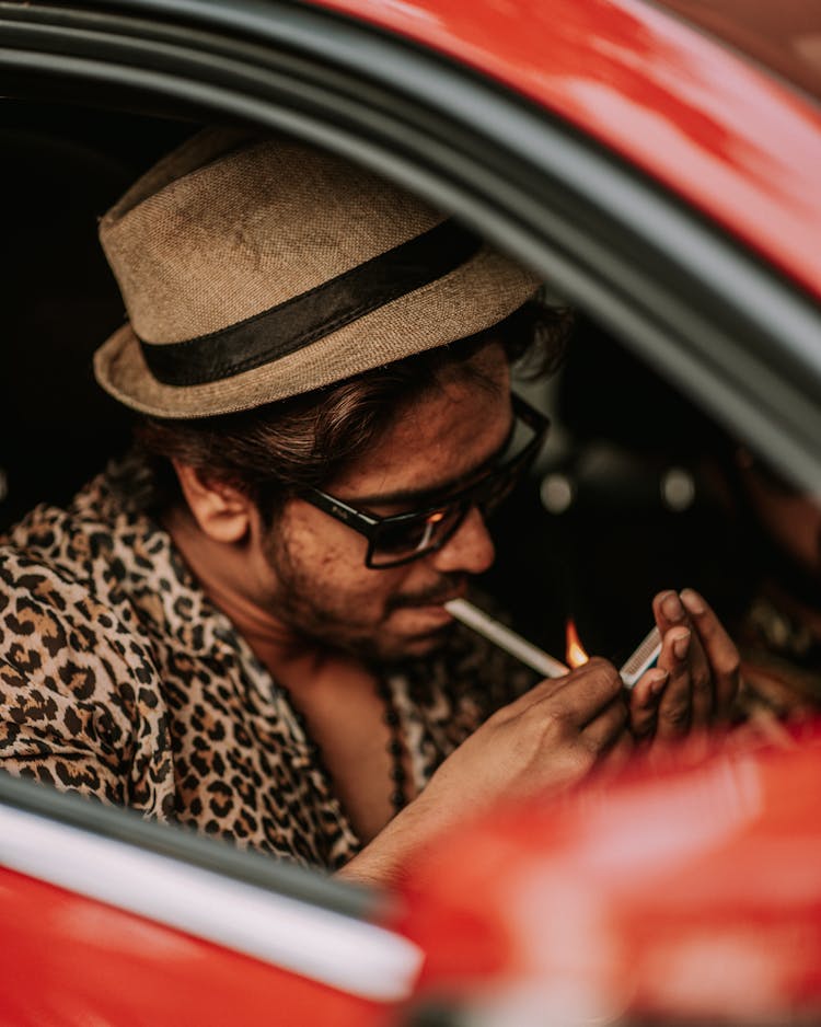 Man Lighting Cigarette In Car