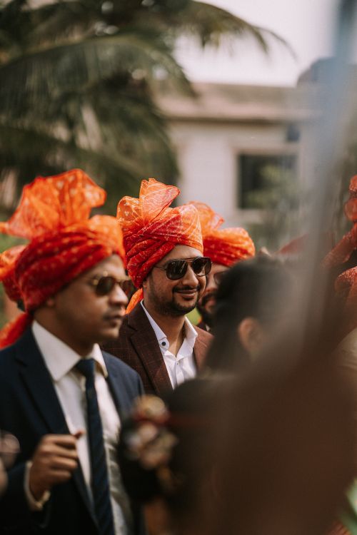 Free Men in traditional Indian attire with vibrant turbans at an outdoor gathering, exuding elegance and cultural richness. Stock Photo