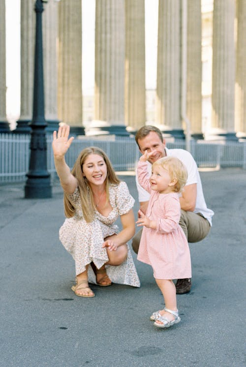 Couple Playing with Their Child in Front of Colonnade of Kazan Cathedral in Saint Petersburg, Russia