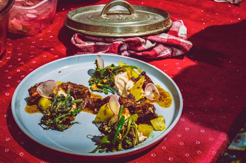 Potatoes with Stewed Vegetables on a Light Blue Plate