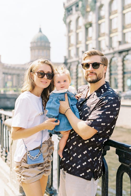 Free Adult Couple with Their Daughter on Trip in Old Town  Stock Photo