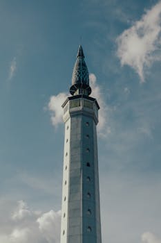 A stunning low-angle shot of a minaret tower in Indonesia's Riau Islands.