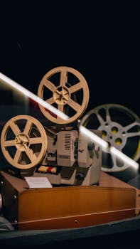 A vintage film projector displayed in a museum exhibit, capturing nostalgia.