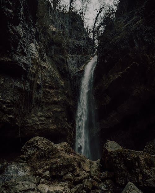 A Waterfall near a Natural Rock Formation